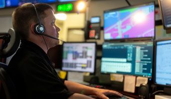 man in front of monitors
