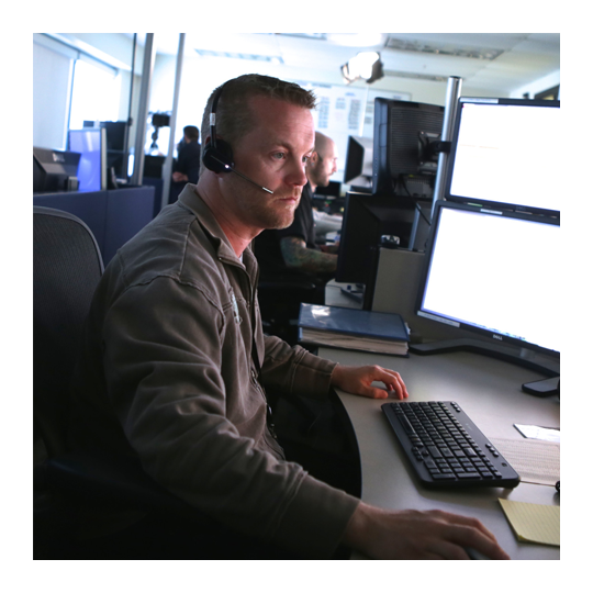 Person looking at computer screens to conduct network penetration testing.