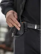 Close up of user pressing full-front ptt button on tlk 25