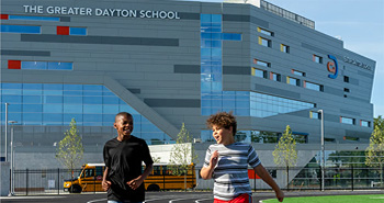 The Greater Dayton building with two running boys