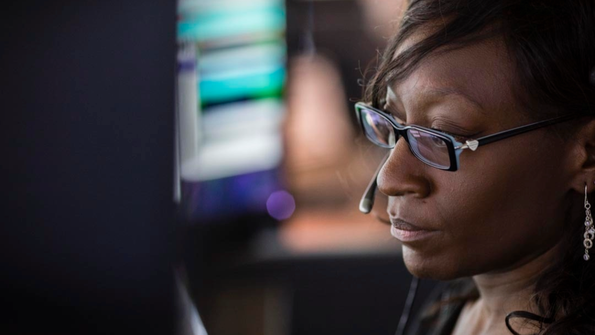 Dispatcher taking calls in a dispatch center
