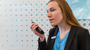 Woman in hotel talking on radio