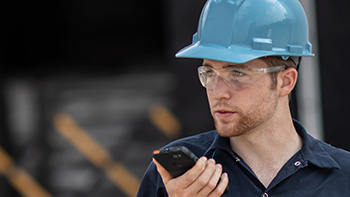 Man using radio in loading dock