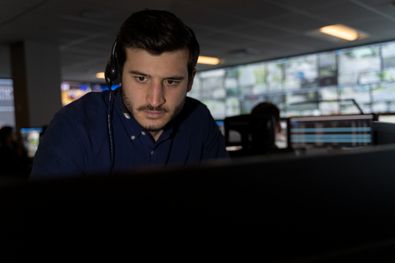 911 call taker at computer