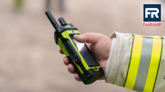 Police officer in the field using radio with SmartProgramming update software