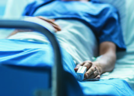 Patient laying in hospital bed