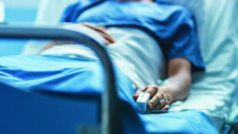 Patient laying in hospital bed