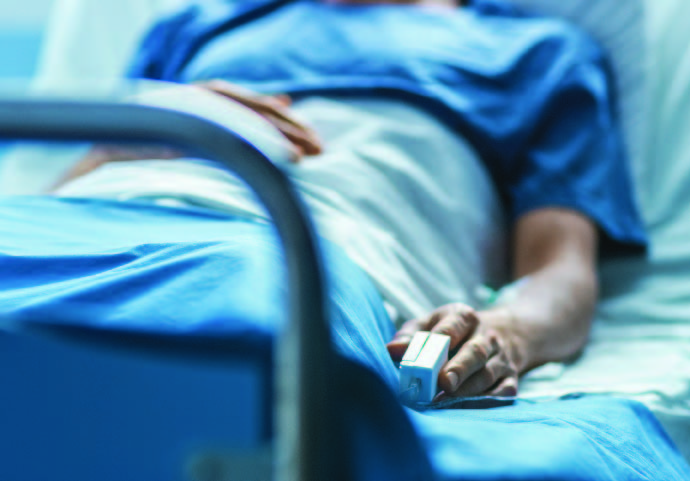 Patient laying in hospital bed