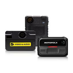 Three Motorola body cameras, one with a red LED, one with a video and audio label, and one blank