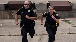 Two police officers running