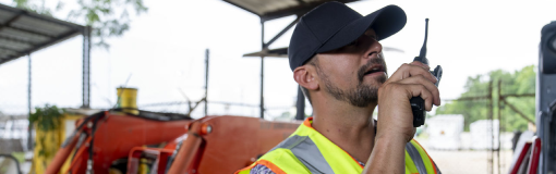 Utility workers communicate with each other by using MOTOTRBO radios.