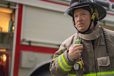 Firefighter talking into radio